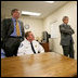 President George W. Bush and Florida Governor Jeb Bush receive a briefing on brush fires at the Hillsborough County Fire Station in Sun City Center, Florida, Tuesday, May 9, 2006. White House photo by Eric Draper